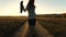 Cheerful business woman rejoices at successful deal. happy business woman walks along a country road with a briefcase in