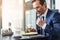 Cheerful businessman eating food in restaurant