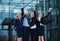 Cheerful businesspeople standing outside office