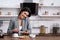 Cheerful businesswoman holding toast bread while