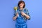 cheerful caucasian man wearing plumber uniform holding toilet plunger celebrating achievement