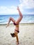 Cheerful caucasian young woman performing gymnastic working out