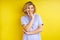 cheerful charming short-haired teen of caucasian appearance isolated over yellow background