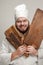 Cheerful chef with wooden box