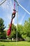 Cheerful child training on aerial silks