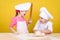 Cheerful children cook pizza