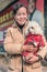 Cheerful Chinese woman poses with her pet, Beijing, China