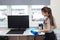 Cheerful cleaning. Young European girl within headphones