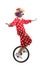 Cheerful clown riding a unicycle and making a funny grimace