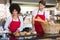 Cheerful colleagues posing with bread