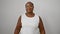 Cheerful and confident african american woman with braids, standing isolated on a white background sporting a beaming smile