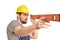 Cheerful construction worker - craftsman in working clothes with a spirit level on white background