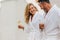 Cheerful couple in bathrobe