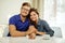 Cheerful couple behind table