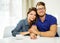 Cheerful couple behind table