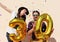 Cheerful couple celebrates a thirty years birthday with big golden balloons