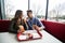 Cheerful Couple in eating burgers fast food Reastaurant