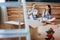 Cheerful couple eating tasty noodles in new house