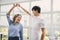 Cheerful couple enjoy dancing together