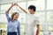 Cheerful couple enjoy dancing together in cafe