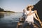 Cheerful couple enjoy summer on the lake