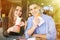 Cheerful Couple In Fast Food Reastaurant Eating Burgers and doner