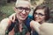 Cheerful couple in glasses makes selfe outdoors