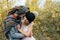 A cheerful couple goes crazy in. Bride in a knitted hat with a pompon and groom in colorful scarf are having fun