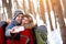 Cheerful couple making winter selfie