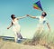 Cheerful Couple Playing Kite Summer Beach Concept