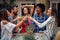 Cheerful couples having toast at the open air birthday party. Quality friendship time together