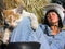 cheerful cowgirl playing with funny kitten in the ranch in series