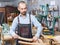 Cheerful craftsman posing in studio