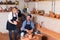 Cheerful craftsman talking to woman in workroom