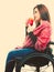 Cheerful crippled lady on wheelchair.