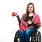 Cheerful crippled lady on wheelchair.