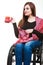 Cheerful crippled lady on wheelchair.