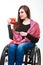 Cheerful crippled lady on wheelchair.