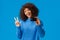 Cheerful cute african-american woman with afro haircut, tilt head show peace sign and holding credit card, got
