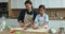 Cheerful cute child girl and happy mom preparing homemade cookies