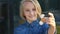 Cheerful cute school aged girl playing with a gold fidget spinner. A popular trendy toy.