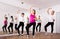 Cheerful different ages women learning swing steps at dance class