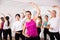 Cheerful different ages women learning swing steps at dance class