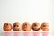 Cheerful eggs, brown. Photo for design