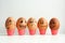 Cheerful eggs in a row, lined up in a semicircle