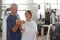 Cheerful elderly couple working out.