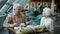 Cheerful elderly man treating beautiful wife to tasty cake during romantic dinner in restaurant