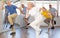 Cheerful elderly woman learning dynamic dances at group choreography lesson