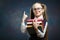 Cheerful Elementary Schoolgirl Hold Book Bunch