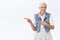 Cheerful, enthusiastic carefree old woman, grandmother with grey hair, wear denim vest, dress, laughing joyfully, see